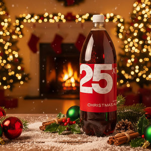 XT Brewing Co XT25 Christmas Ale Dark Red 2-Litre Plastic Bottle with a fireplace and golden lights Christmasy background.
