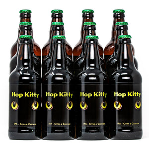 A colour photo of 12 XT Brewing Co Hop Kitty beer bottles with green bottle caps caps and Hop Kitty labels with bright green cats eyes looking forwards