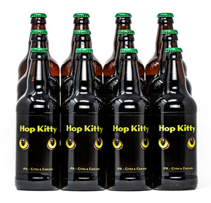 A colour photo of 12 XT Brewing Co Hop Kitty beer bottles with green bottle caps caps and Hop Kitty labels with bright green cats eyes looking forwards